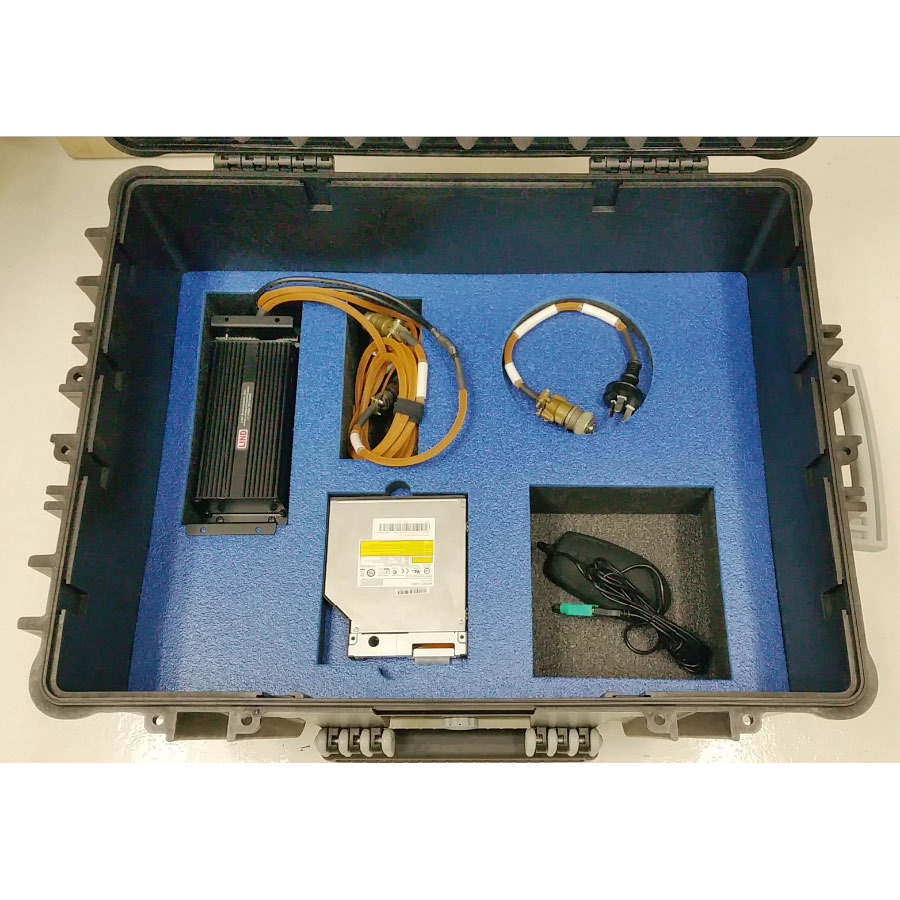 PCG custom transit case showing power adapter, cables and accessories in lower compartments from above