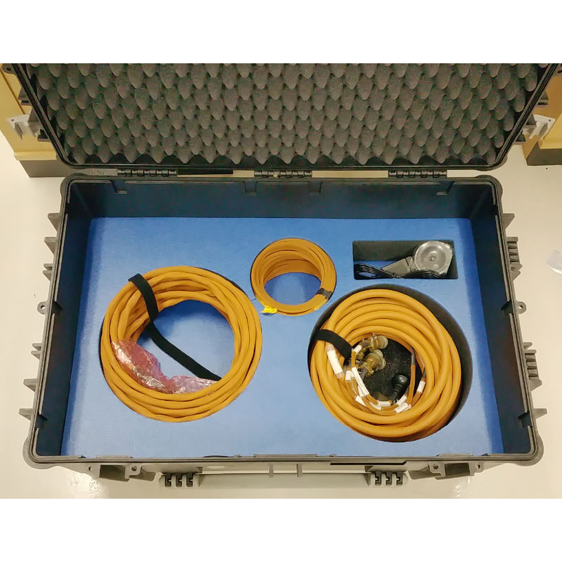 PCG custom transit case showing cables in lower compartments from above