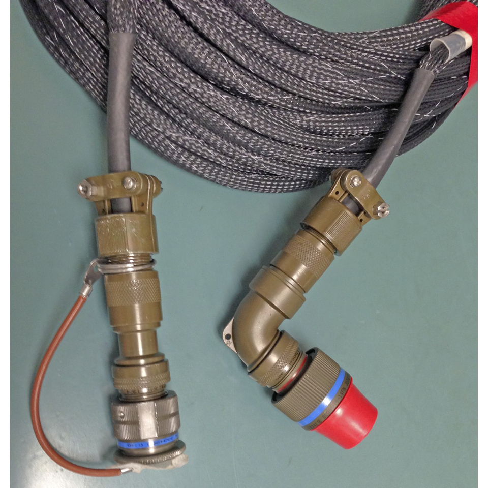 200’ armored shielded interface cable coiled for installation in transit case with MIL-D-38999 straight plug and right angle plug close-up of plugs